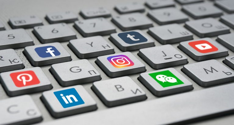 Symbols of social media on keys of a keyboard